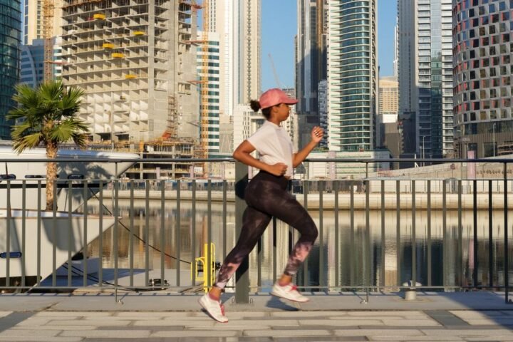 Woman running in city