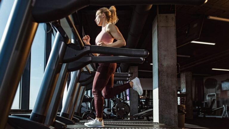 Woman running on a treadmill in the gym